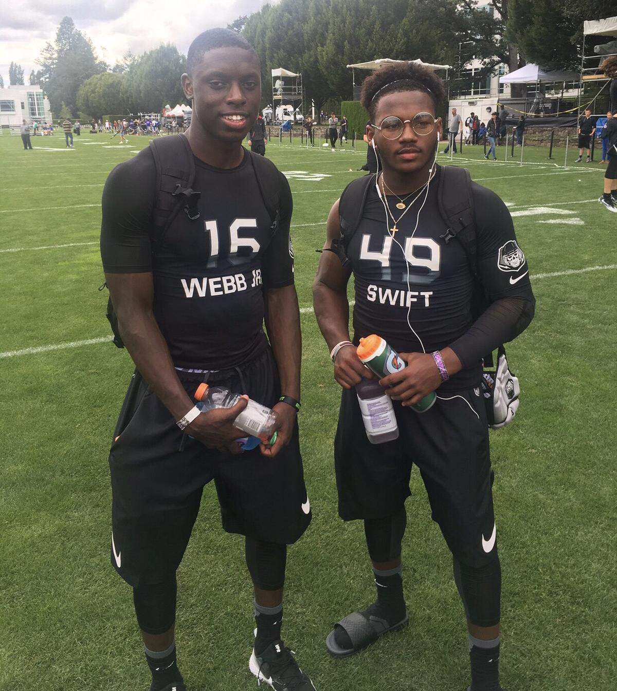 Cousins Mark Webb, Jr. (left) and D’Andre Swift attended football camps together in high school. Now the two play for the University of Georgia Bulldogs.