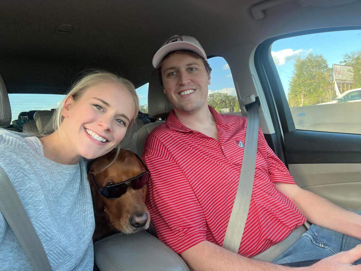 Alex and William Amos with their dog, Sanford.
