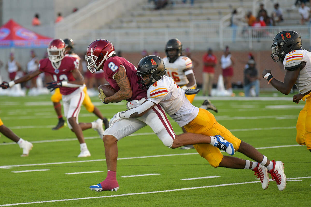 Northeast’s Zion Paul tackles Carver’s De’Ante Childs, holding him to a two-yard gain in the opening series of the third quarter of the game Friday night September 8, 2023, at Otis Spencer Stadium in Columbus, GA.