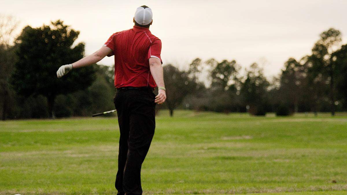 Lance Byrum tosses his driver after hitting his tee shot on the Par 4 17th at Bowden Golf Course Sunday afternoon. The course reopened the back nine Sunday after closing due to the recent rain. The front nine were reopened on Saturday.