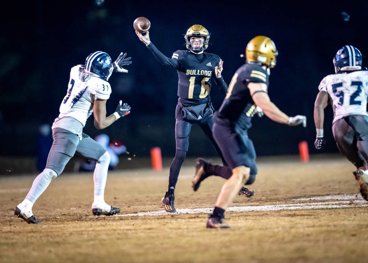 Mary Persons quarterback Mac Nelson (16) attempts a pass in the GHSA AAA playoffs Friday night versus Cedar Grove.