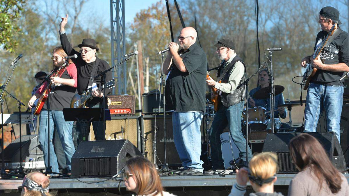 Guitarist Dave Perkins of Nashville, second from left, performs with The Skydog Macon Ensemble Sunday at Central City Park where the music was all blues and Southern rock.
