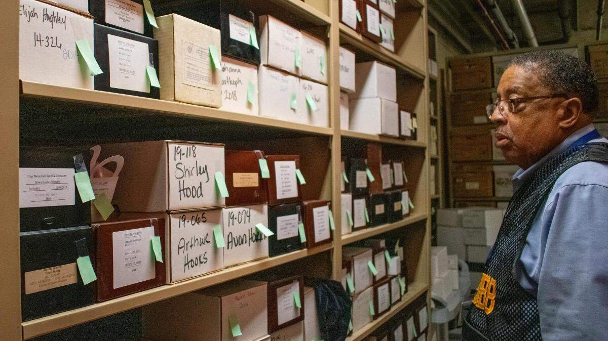 The cremains of about 400 people are stored in boxes in the basement of the Bibb County Sheriff’s Office.