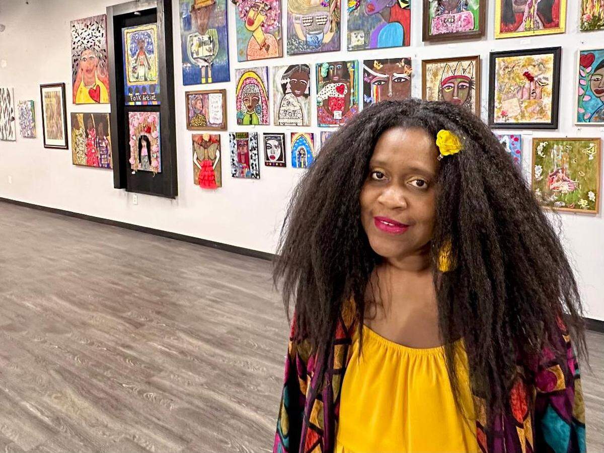 Macon artist Rhonda “Sunshine” Miller opens a solo exhibit at the Macon Arts Alliance gallery on First Street for First Friday. Miller is shown with her work as part of a community exhibition of artists celebrating Macon’s 200th anniversary in 2023.