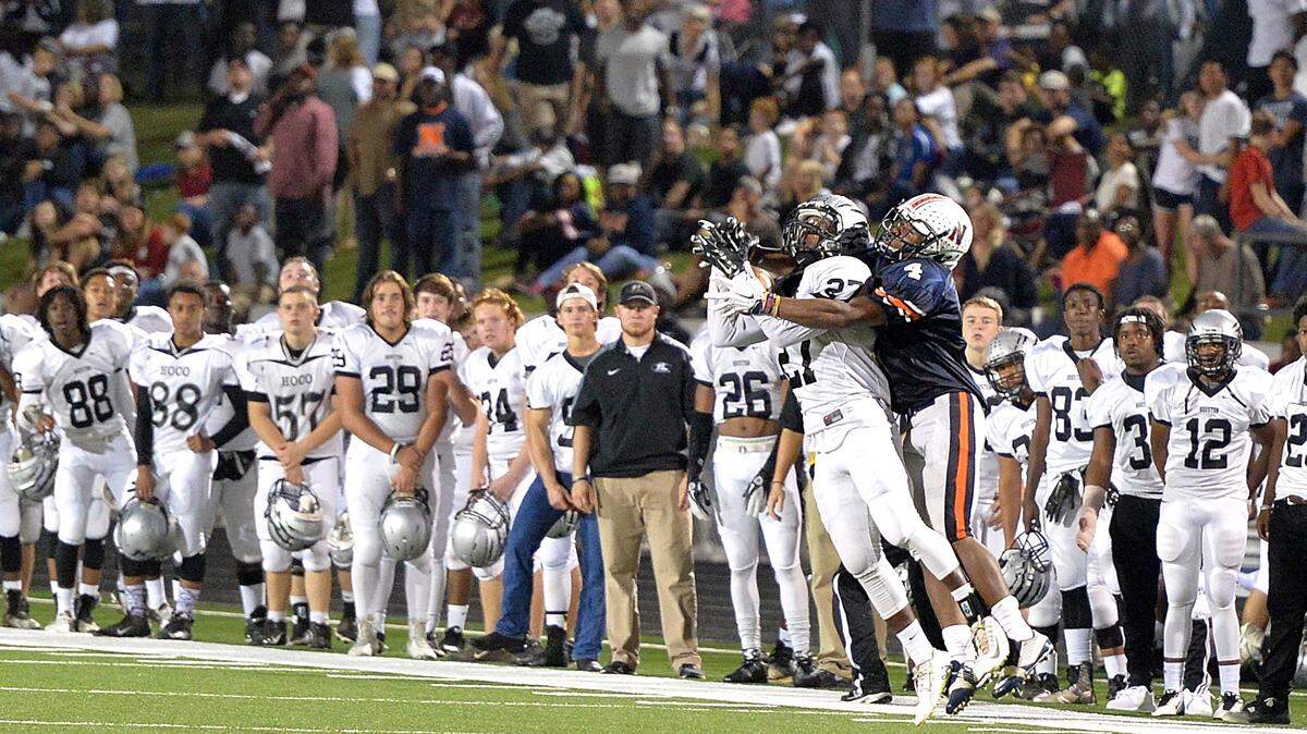 Houston County defensive back Stefan Hill (27) intercepts a pass intended for Northside receiver Marcus Jolly (4) during their game Friday night.