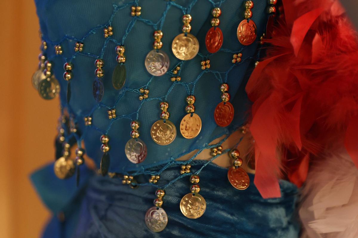 Coins and beads hang off of a costume on display in Perry Belly Dance Studio on Thursday, Aug. 29, 2024, in Perry, Georgia. Perry Belly Dance Studio opened in 2010 and offers classes for all ages and skill levels.