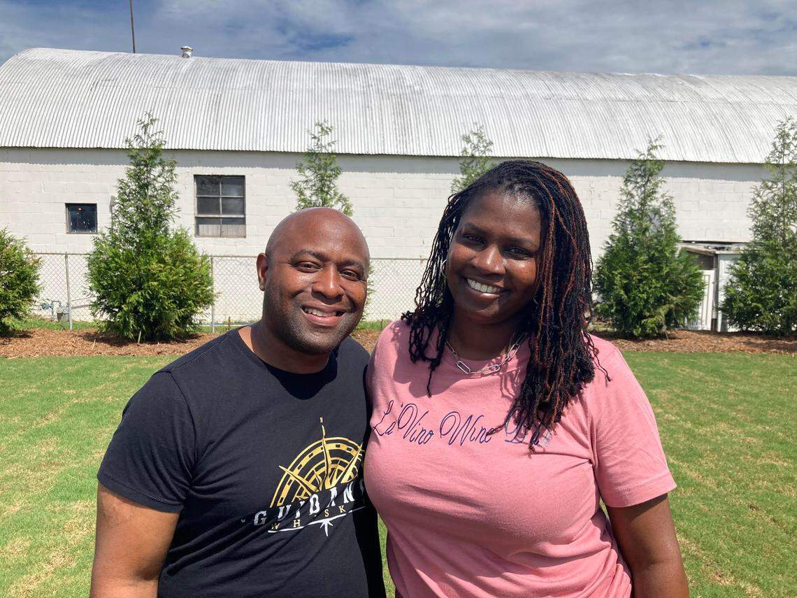 Ebony Lewis, right, with the help of her husband, Marc, is opening La’Vino Wine Bar at 106 South Kimberly Road in Warner Robins. She plans to to have patio seating in the back and add picnic tables on the grassy area where they’re standing for summer gatherings.