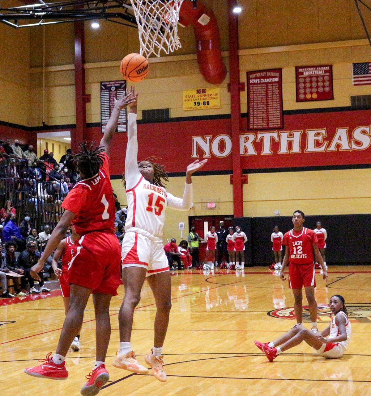 Northeast’s Shadae Thorpe (15) goes up for a layup over a Laney defender during the Raiderettes’ 85-52 win Wednesday night to advance to the GHSA 2A Final 4.