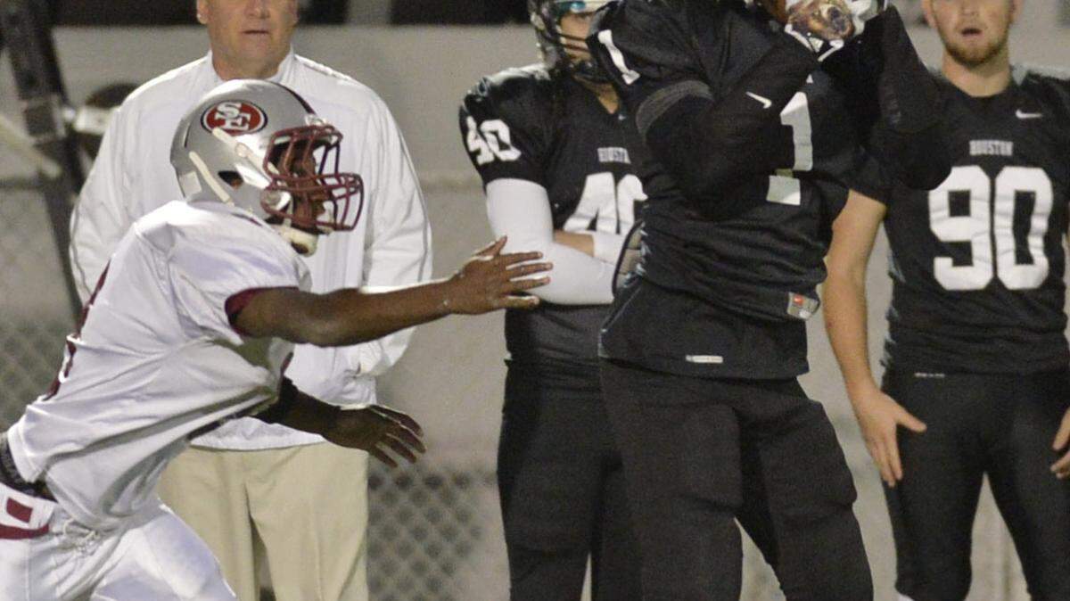 BEAU CABELL/THE TELEGRAPH 
 Warner Robins, Ga., 11/13/2015: Houston County receiver Eli Watson (14) hauls in a pass from Jake Fromm.