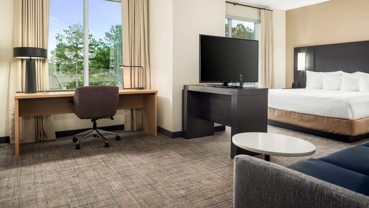 A king studio suite at a Residence Inn by Marriott in Decatur that also includes a kitchenette. The rooms at a New Residence Inn by Marriott in Warner Robins now under construction are expected to be similar, according the developer.