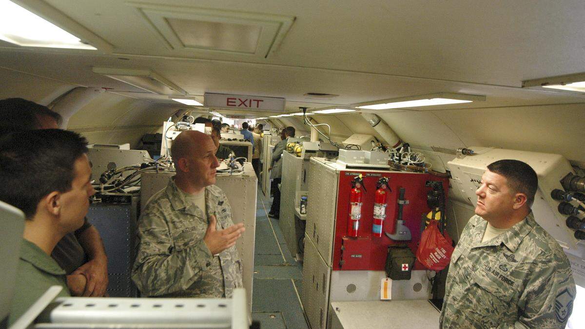 Airmen and industry representatives gather in the back of an E-8C J-STARS aircraft last year at Robins Air Force Base.