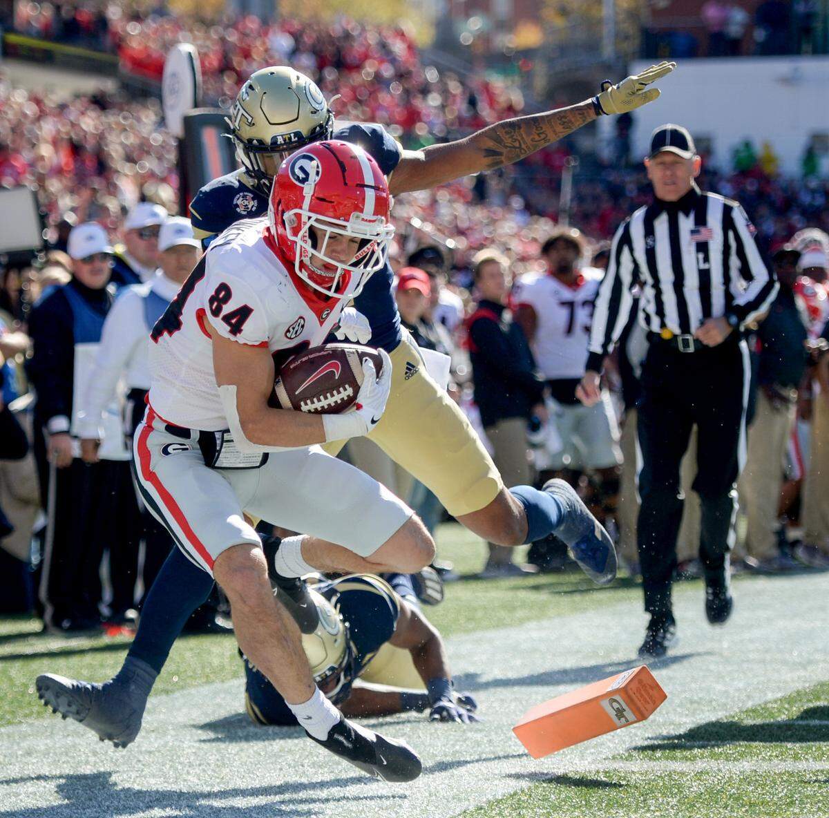 Georgia receiver Ladd McConkey (84) scores a touchdown during the Bulldogs 45-0 win over Georgia Tech Saturday in Atlanta.