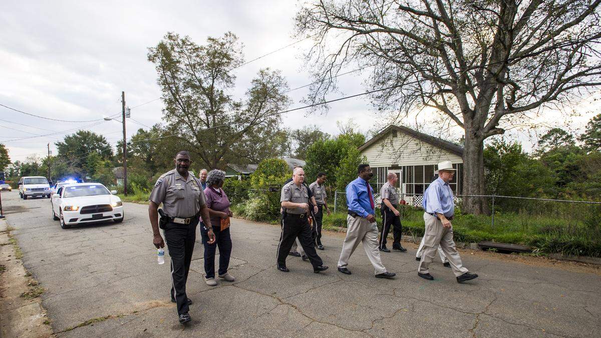 WOODY MARSHALL/THE TELEGRAPH.Macon, Georgia, 10/29/2015: Sheriff David David walks with deputies around the Lynmore Estates neighborhood in October during a Walk for Safety. A similar event is planned for Thursday near the Vine-Ingle Little League fields, Freedom Park and Brookdale Elementary School.