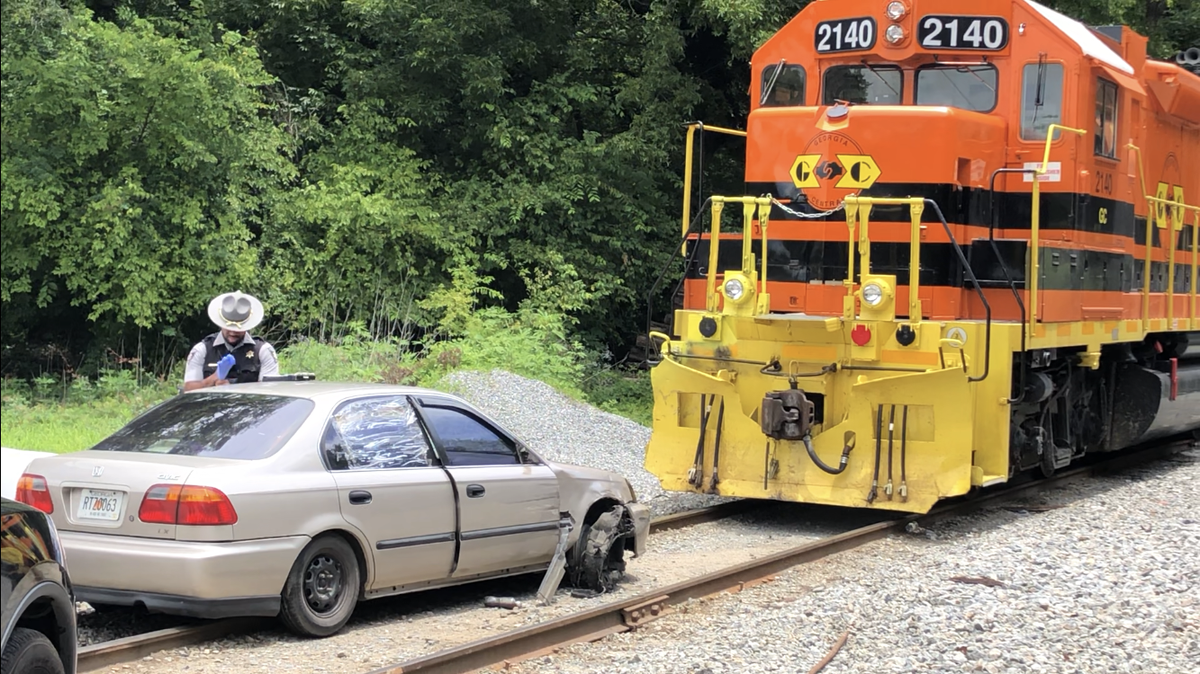 A Wednesday afternoon police chase ended at a railroad crossing on the backside of Macon’s Central City Park when the driver of the car being chased stopped in front of a parked train.
