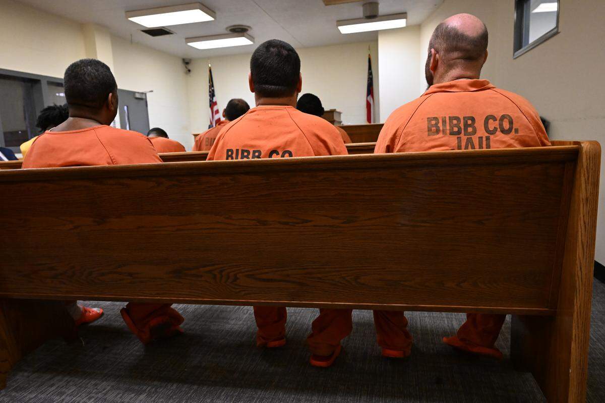 Bibb County Jail detainees listen to a speaker during the Just Walk Away initiative at the Bibb County Jail on Wednesday, Aug. 13, 2025, in Macon, Georgia. The Just Walk Away Initiative mentors incarcerated people in Macon on violence prevention and shares information resources for them in and out of jail. 