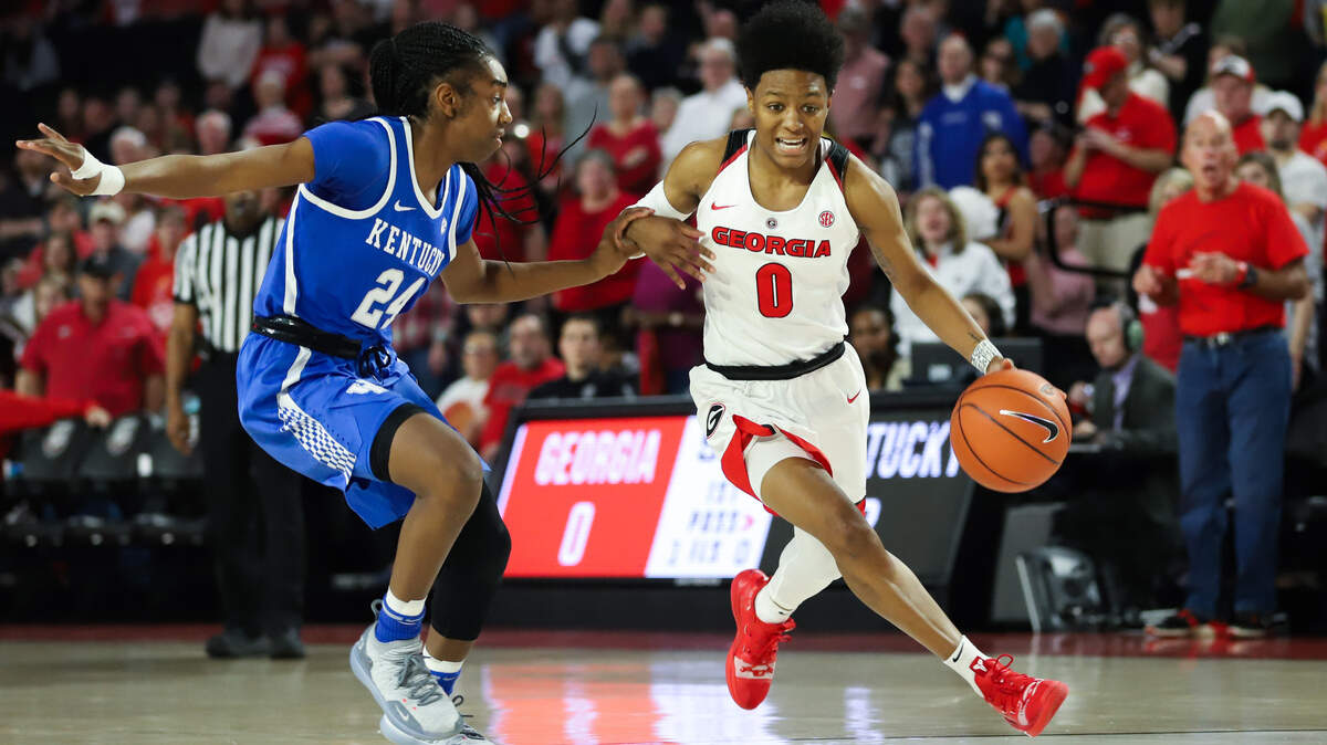 Georgia guard Taja Cole (0) dribbles past a defender during a game between the University of Georgia and the University of Kentucky in Stegeman Coliseum in Athens, Ga., on Sunday, March 3, 2019.
