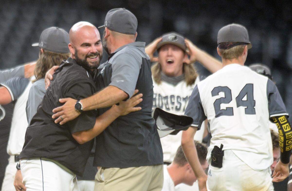 Houston County players and coaches celebrate their GHSA 6A Championship series win over Lassiter Wednesday in Atlanta.