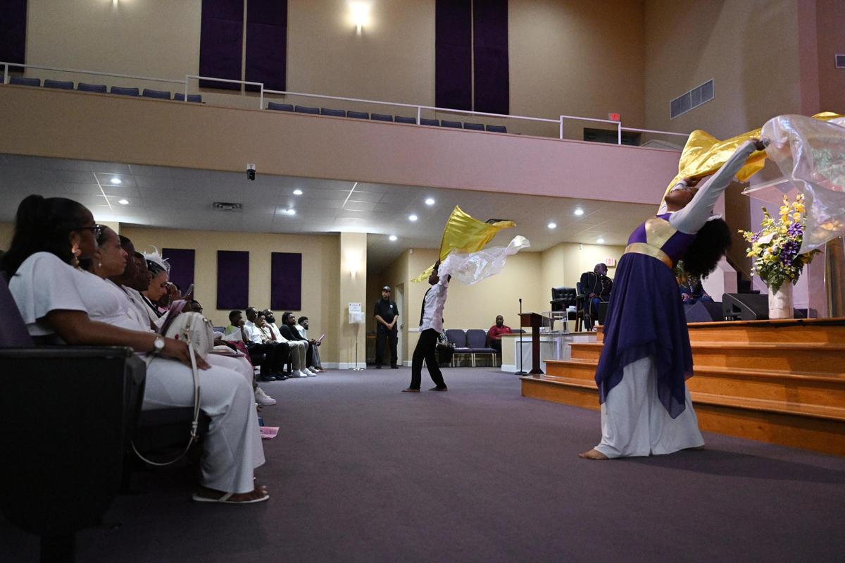 Reaiah Coleman (right) and Caleb Braswell, cousins of A’Layah Joyner, perform a dance tribute with Kiara Braswell (not pictured) during the funeral of A’Layah Danielle Joyner on Saturday, April 26, 2025, at Macedonia Baptist Church in Macon, Georgia. Family and friends of gathered on Saturday to celebrate A’Layah’s life and call for justice after her death.