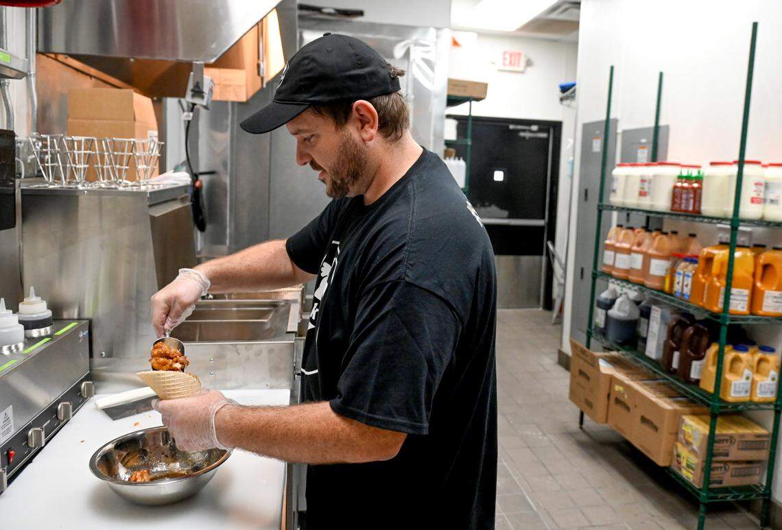 Owner Wes Kostovetsky puts together a cinna-maple Chick’nCone at Chick’nCone that opens Saturday at 860 Forsyth St. in Macon.