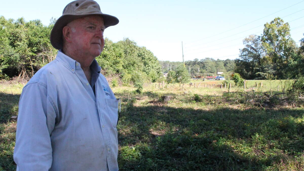 LAURA CORLEY/THE TELEGRAPH Randall Dodd, treasurer of the Warner Robins Lion's Club, has been clearing a lot on Moody Road to build a handicapped-friendly park near the site where the club's building is planned.