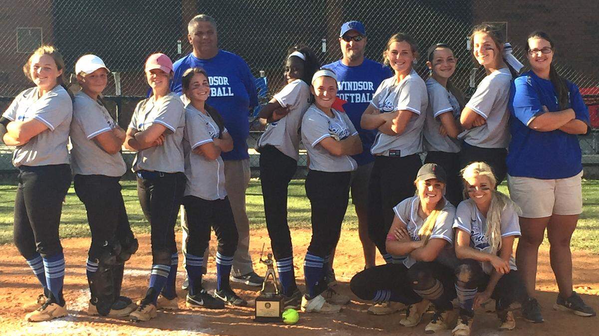 Members of the Windsor softball team pose with the GISA Class AA championship trophy they won Saturday in Americus.