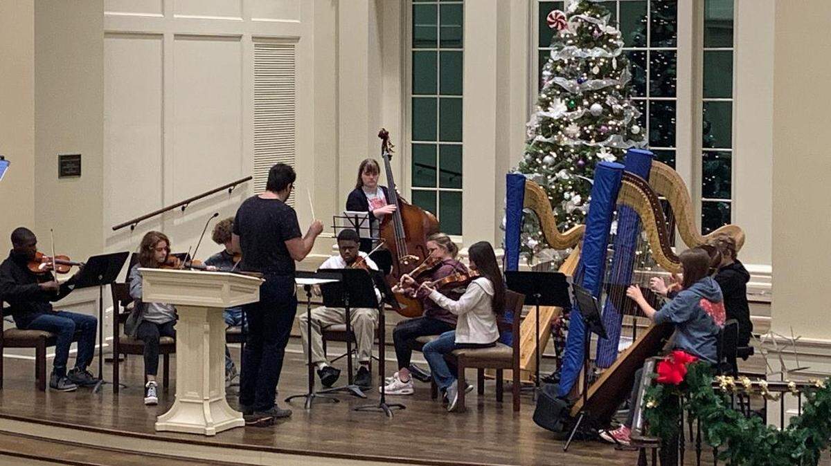 Members of the newly reformed Macon Youth Orchestra rehearsing for their holiday concert today at 6:30 p.m. at Wesleyan College’s Pierce Chapel. 