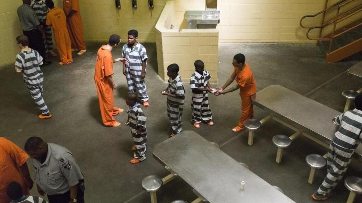 Bibb County Law Enforcement Center inmates interact with youths enrolled in the Bibb County Sheriff's Office Consider the Consequences program, a one-year-old Scared Straight program.