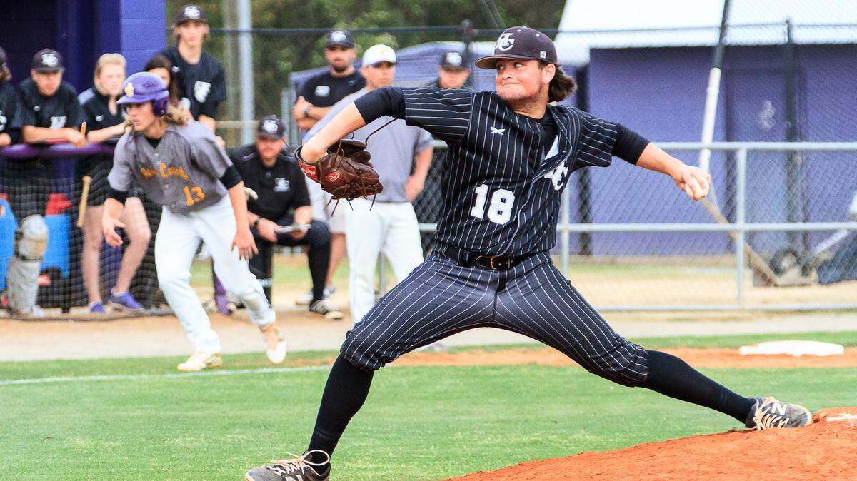 CLAY TEAGUE/FOR THE TELEGRAPHGray, GA, 3/18/16Houston County's Tanner Hall (18) pitches as Jones County's Bradley Hunnicutt (13) gets his lead from third base.