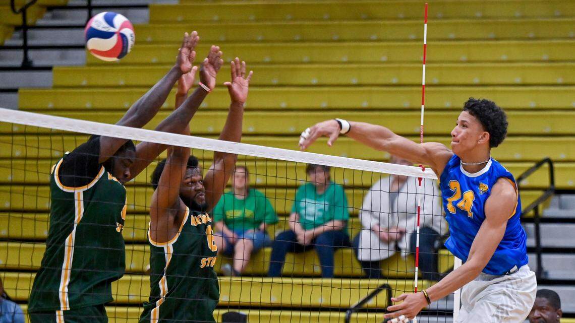 Fort Valley State’s Tavian Martin (24) spikes the ball during the Wildcats three set win over Kentucky State Thursday during the first round of the SIAC conference tournament.