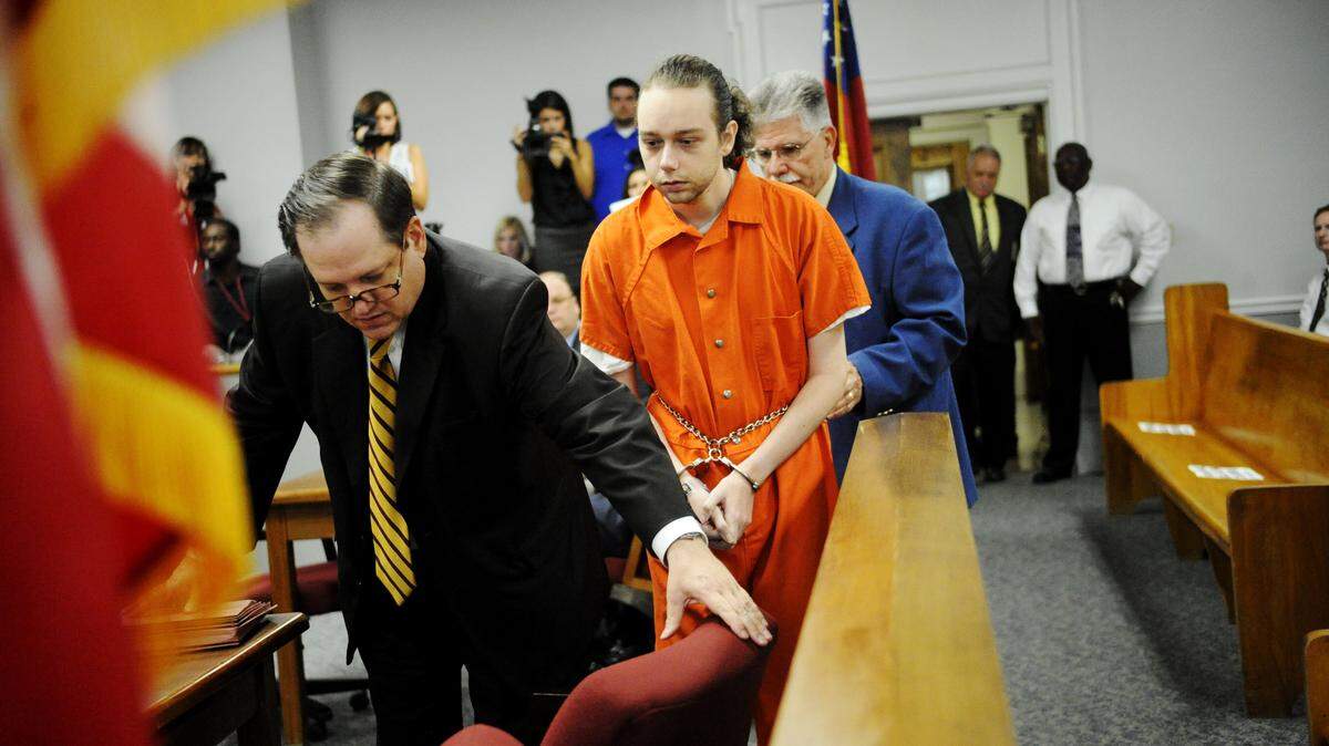 Stephen McDaniel follows attorney Floyd Buford into a Bibb County courtroom in 2011, not long after McDaniel was charged with murder in the death of Lauren Giddings.