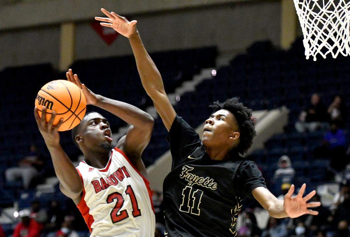 BaldwinÕs Shatavious Hogan (21) goes up for a shot during the BravesÕ GHSA 4A State Championship game against Fayette County Wednesday night in Macon.