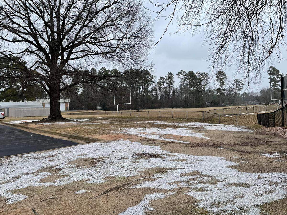 Snow dusts the ground near Tanner Park in Warner Robins mid-afternoon Tuesday.
