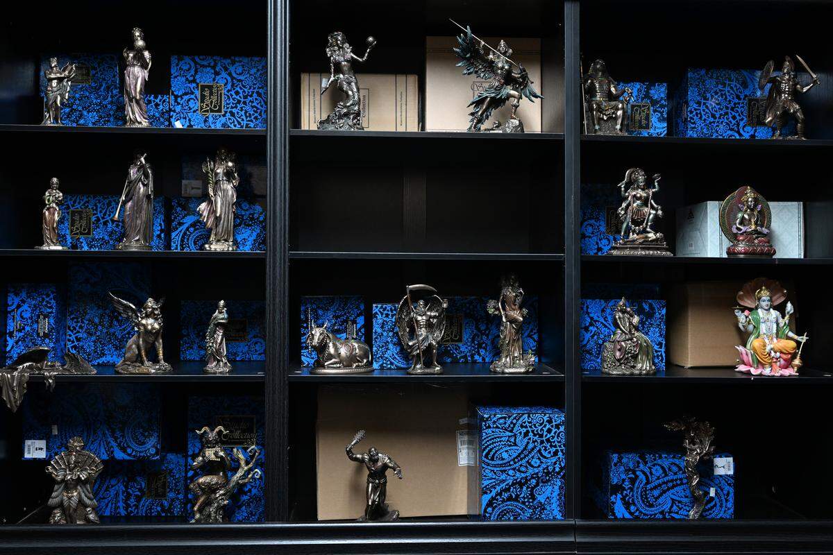 Various figurines sit in one of two back showrooms of The M Cave in Centerville. The M Cave opened its permanent storefront in November and carries a wide variety of merchandise honoring various religions, as well as other spiritual practices.