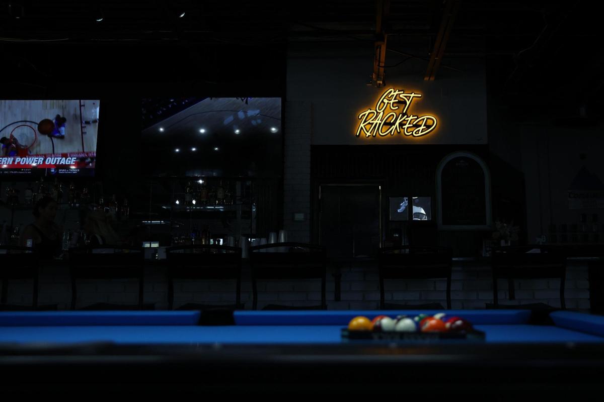 An LED sign hangs above the bar at Brass Rack on Wednesday, Oct. 30, 2024, off of Riverside Drive in Macon, Georgia. Brass Rack opens on Friday, Nov. 1, and aims to create an atmosphere for all ages to gather.