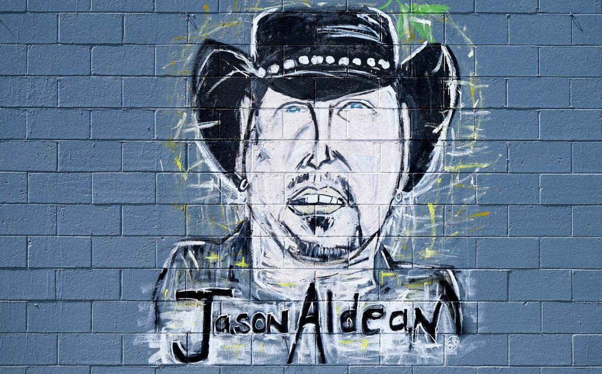 Mural of Jason Aldean located on the side of the South Plaza shopping center on Pio Nono Avenue in Macon.