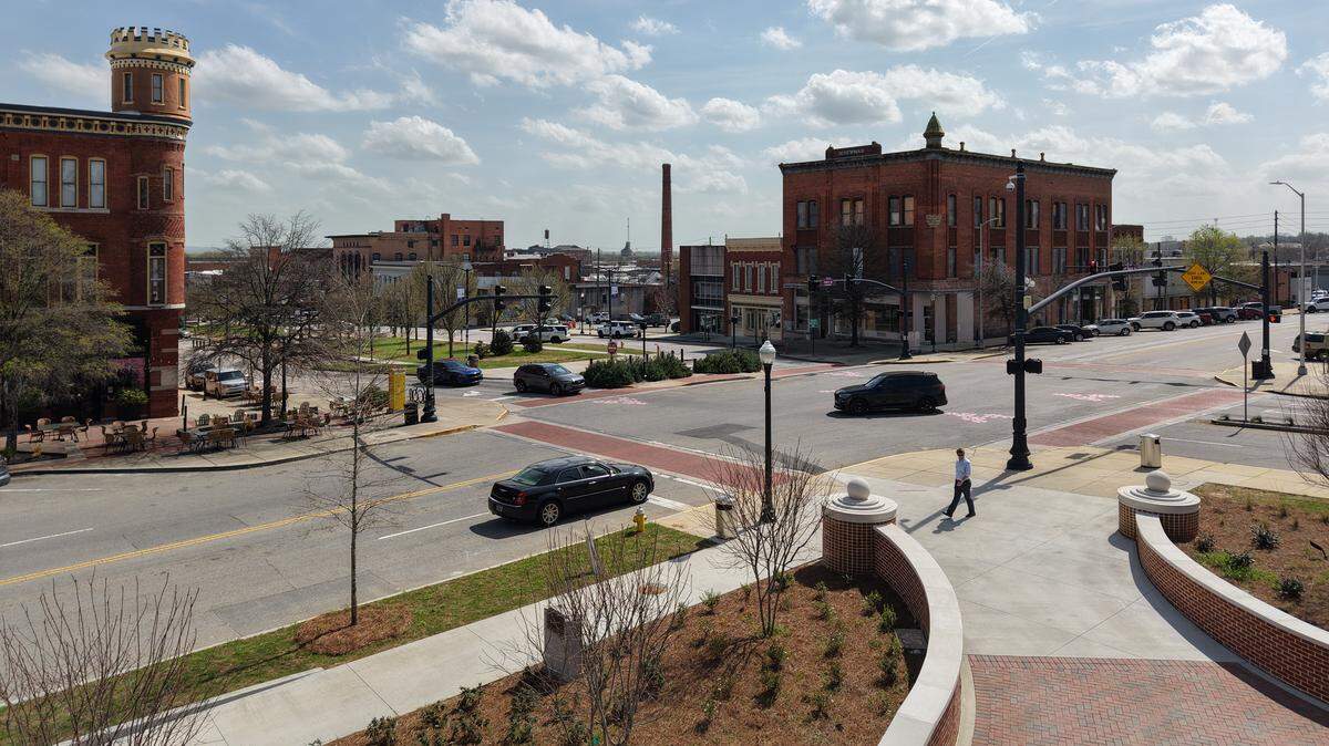 The intersection of First and Poplar Streets in downtown Macon, Georgia. Downtown Macon’s Business Improvement District hired Shakita Howard as an outreach specialist to connect unhoused people downtown with resources.