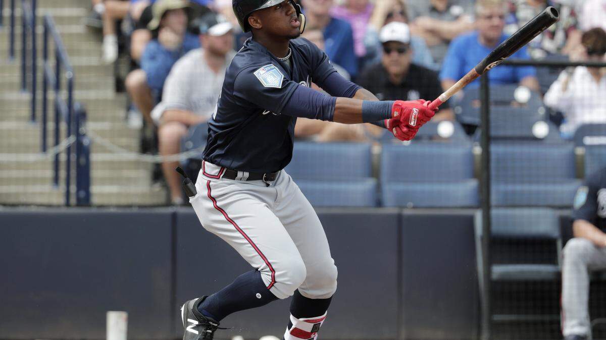 Atlanta Braves' Ronald Acuna watches after hitting a two run home run during the first inning of a baseball spring exhibition game against the New York Yankees, Friday, March 2, 2018, in Tampa, Fla.