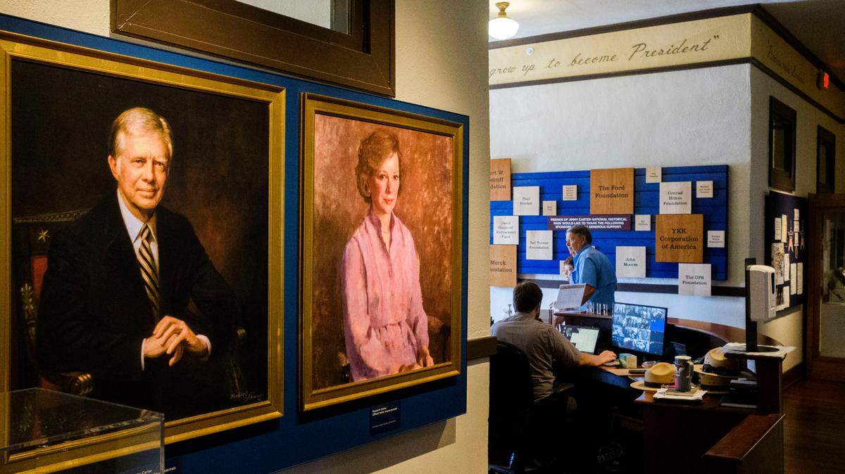 Portraits of Jimmy Carter and his wife Rosalynn hang in the hallway of the former Plains High School, Carter’s alma mater and now the centerpiece of the Jimmy Carter National Historic Site.