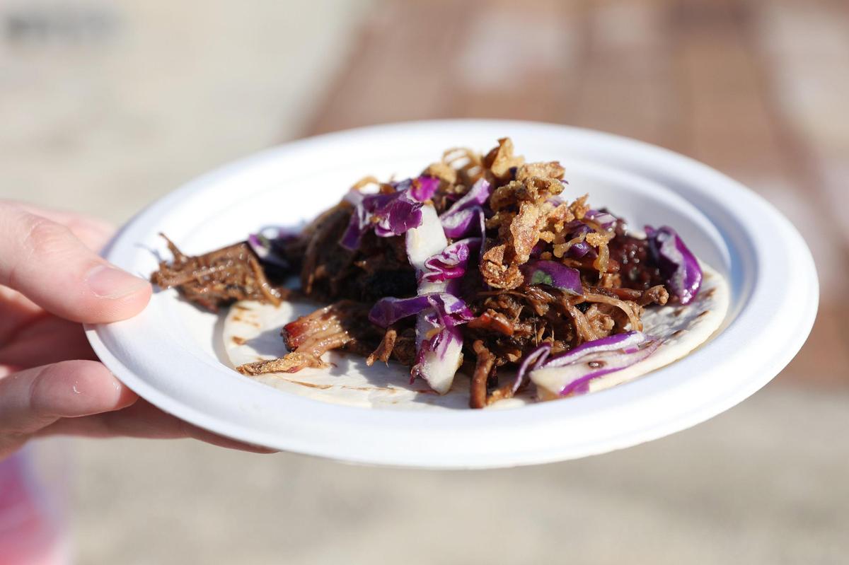 A Cherry Chipotle Smoked Brisket Taco from Satterfield’s BBQ sits on a plate during the Pink Provisions Trail preview on Friday, March 21, 2025, in downtown Macon, Georgia. Local Macon restaurants and bars debuted pink bites and drinks to celebrate the International Cherry Blossom Festival, all of which are available throughout the festival.