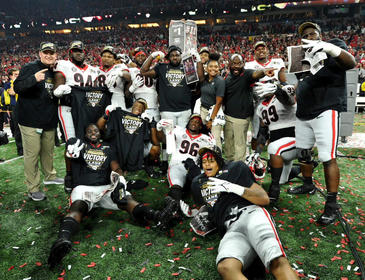 Georgia players celebrate the Bulldogs’ 33-18 win over Alabama in the College Football Playoff National Championship game Monday night.