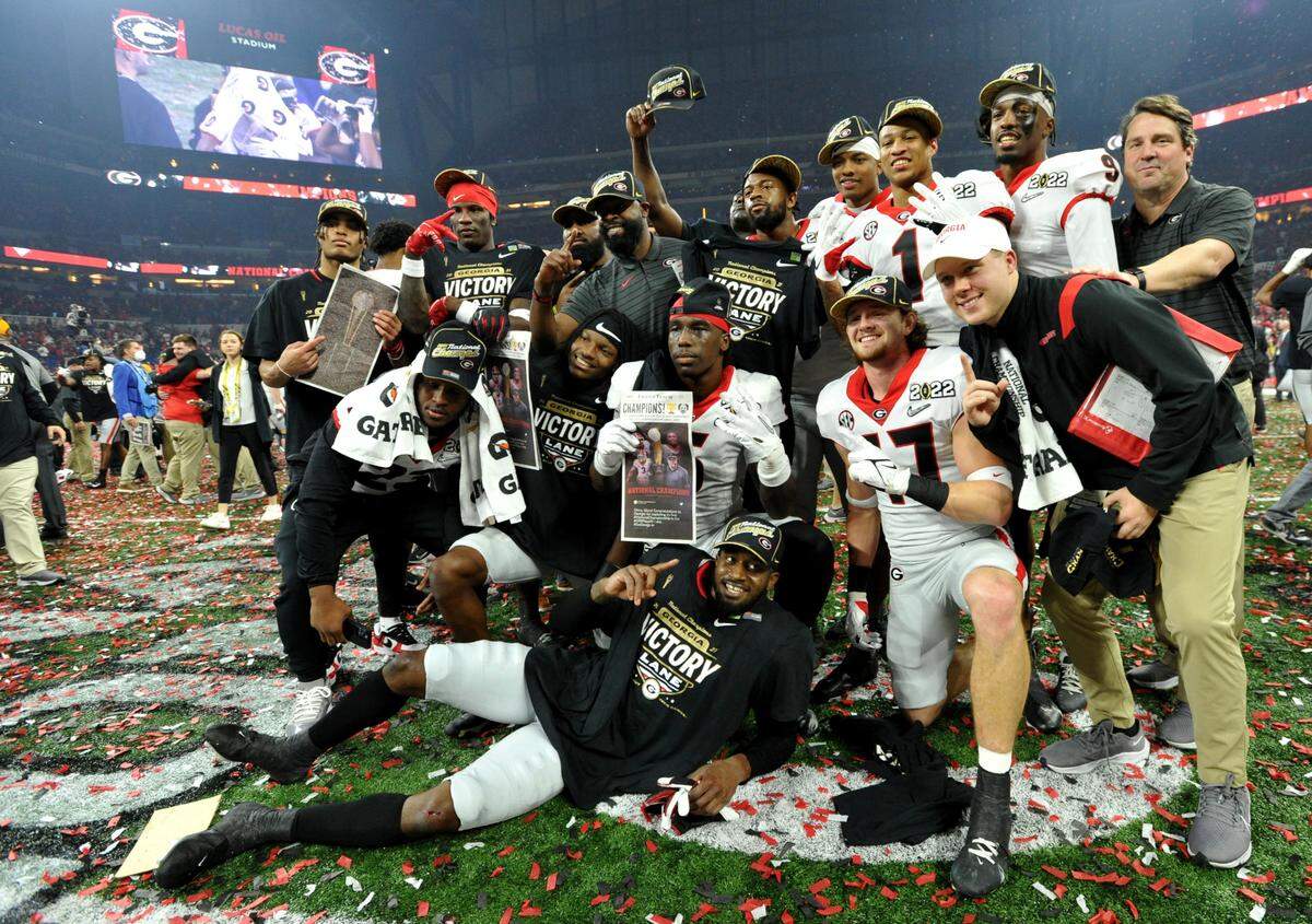 Georgia players celebrate the Bulldogs’ 33-18 win over Alabama in the College Football Playoff National Championship game Monday night.