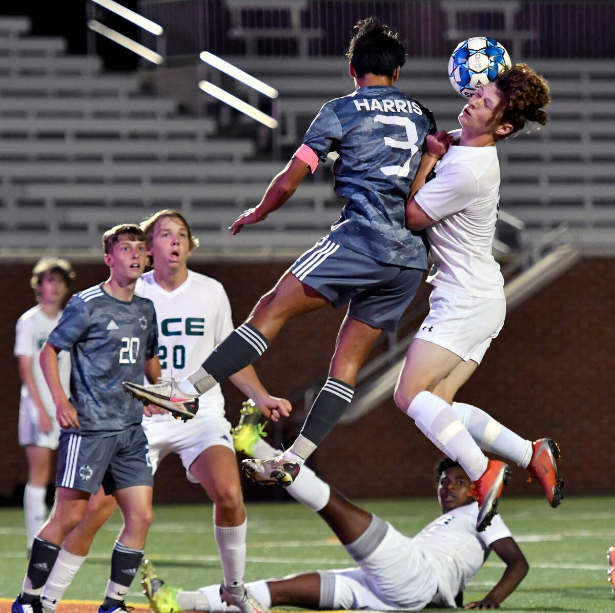 GMC right back Jack Harris (3) and ACE midfielder William Hilton (2) collide during their GHSA 1A State Championship match Friday night at Mercer.
