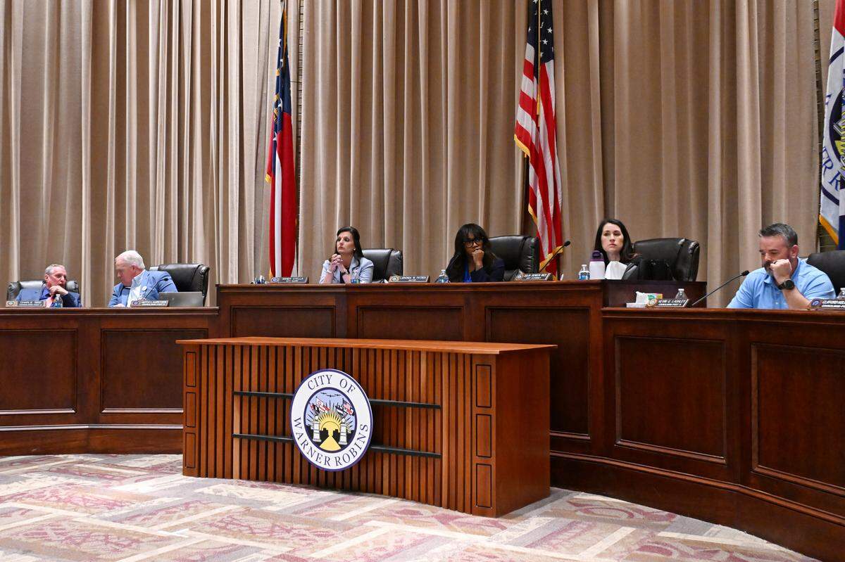 Warner Robins mayor and council members discuss new business during a council meeting on Monday, March 2, 2026, at City Hall in Warner Robins, Georgia.