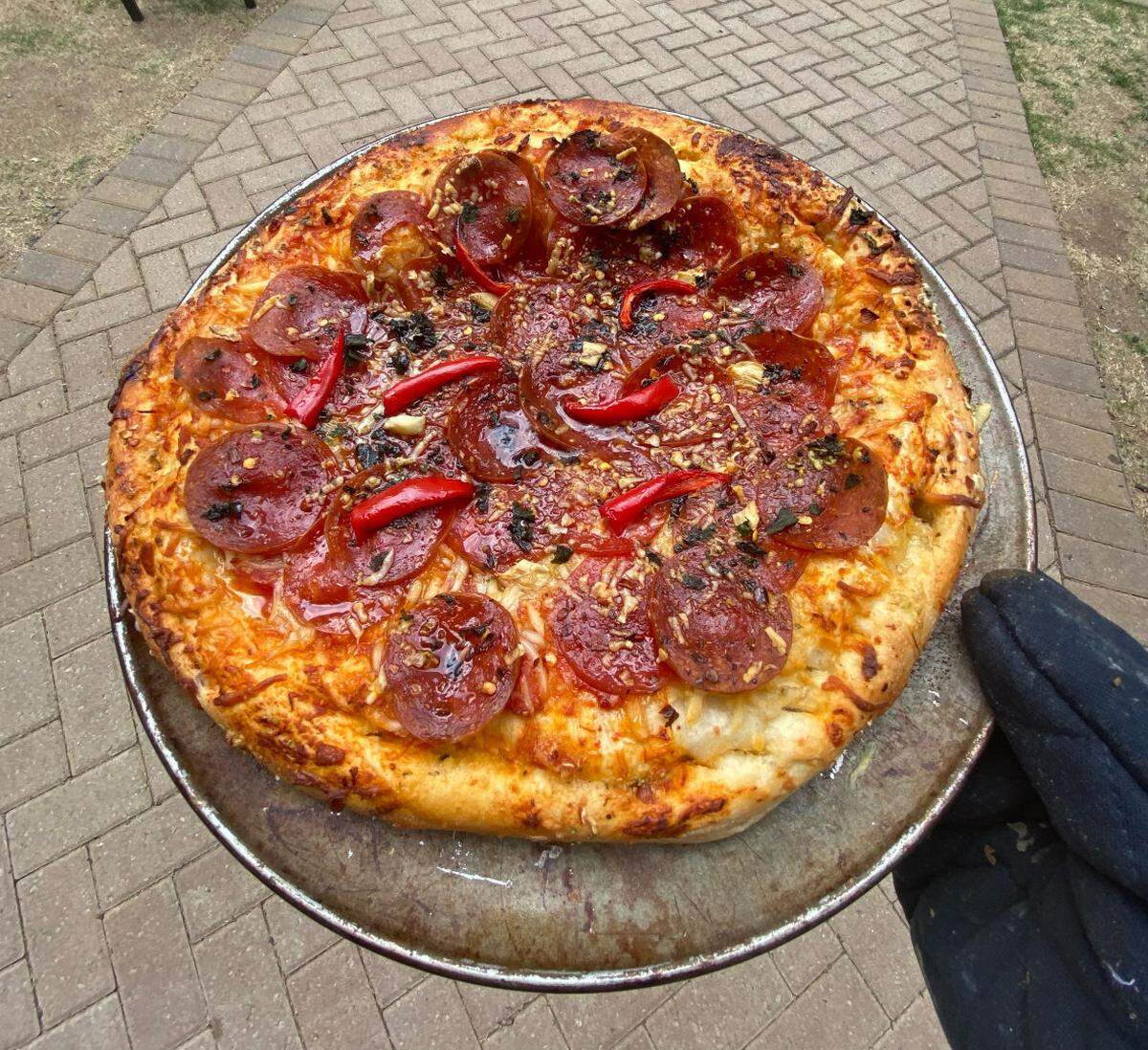 Homemade pizza, by chef Christian Laureano. It’s got pepperoni, chopped basil, chopped garlic and red peppers.