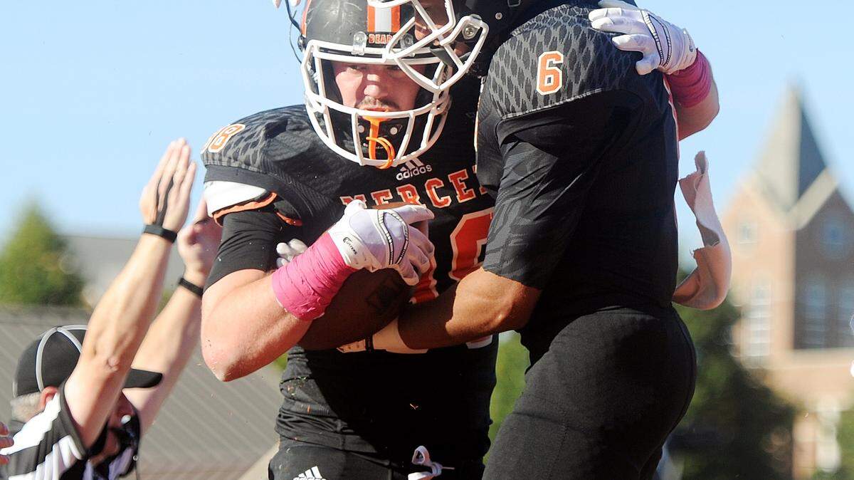 Mercer tight end Robert Brown (38) is congratulated by teammate Josh Jones (6) after a touchdown during the Bears' game against East Tennessee on Saturday.