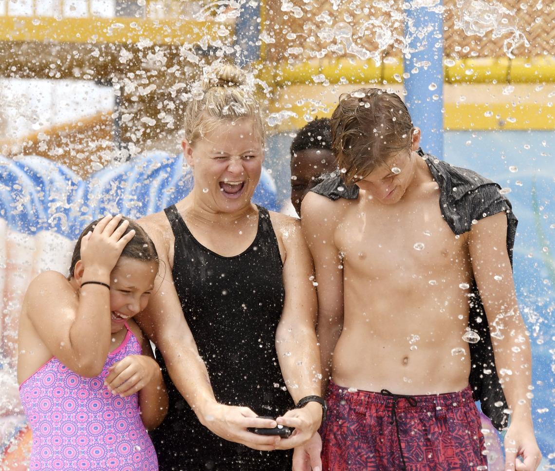 FILE: Gracie Rigby holds an action camera as a bucket of water falls down on her, her brother Luke Rigby, right, Raelee Brown and Ernest Middlebrooks at Rigby’s Water World in 2018.