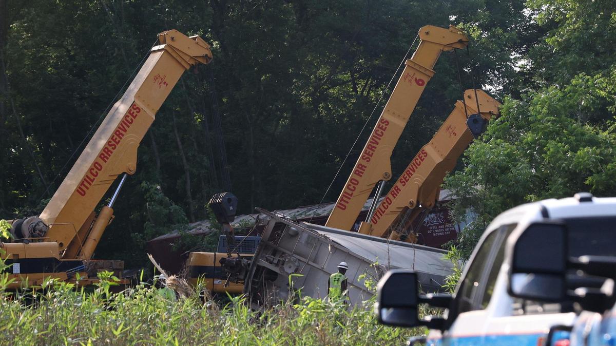 Cranes pull overturned railcars after a derailment on Monday, May 19, 2025, near Lower Poplar Street in Macon, Georgia. A train fell off of tracks Monday in downtown Macon, and clean up is expected to be finished by Monday evening.