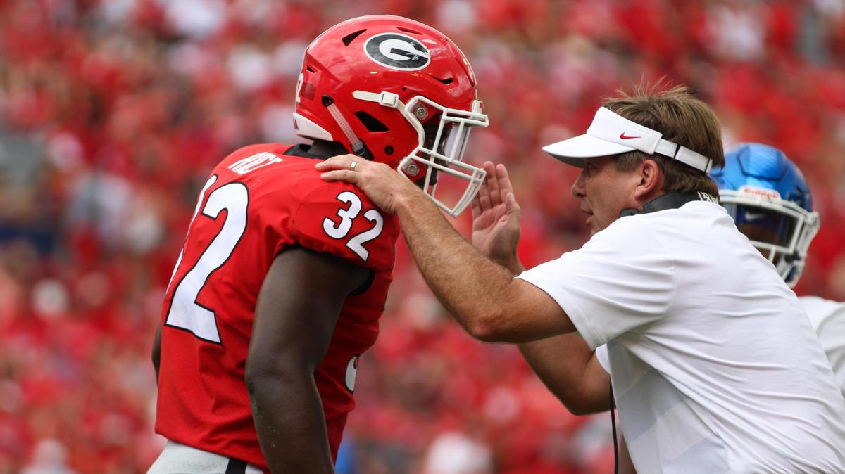 Georgia head coach Kirby Smart directs inside linebacker Monty Rice (32) during a college football game between The University of Georgia and Middle Tennessee State University in Stanford Stadium in Athens, Ga. on Saturday, Sep., 15, 2018. (Photo by Lauren Tolbert).