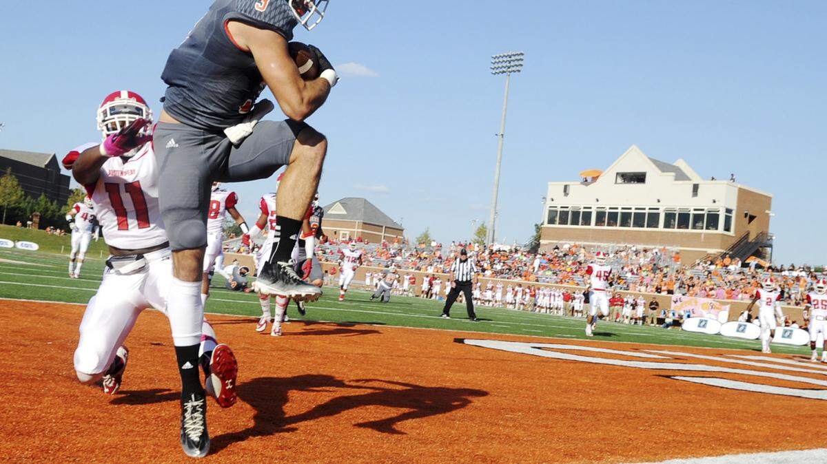 Mercer’s JT Palmer pulls in a pass that was called out of bounds against Austin Peay in 2014.