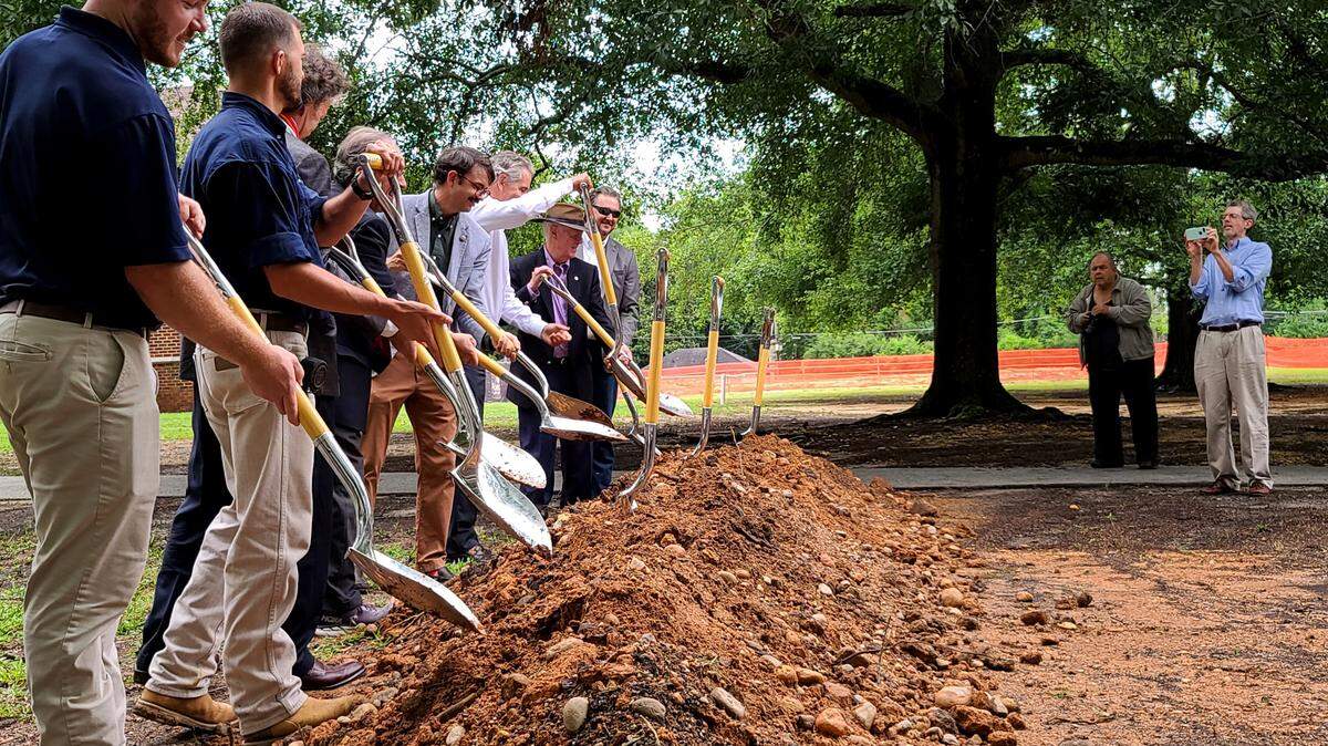 Various members of Historic Macon Foundation, Dover Signature Properties, and Piedmont Construction Group breaking ground just in front of Alexander IV Elementary school. The school is being renovated to become a senior living center by the same name.